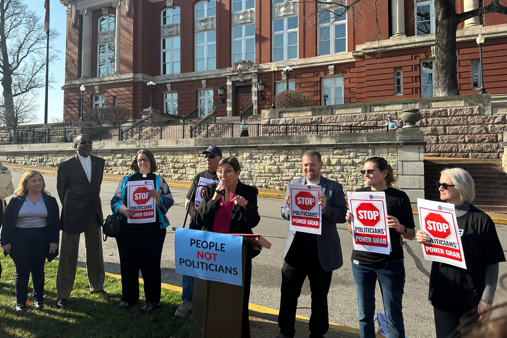 Suzanne Luther, the lead plaintiff in a lawsuit challenging Missouri's mid-decade congressional redistricting, speaks at a rally on March 10, 2026, outside the Missouri Supreme Court building in Jefferson City, Mo, (AP Photo/David A. Lieb)