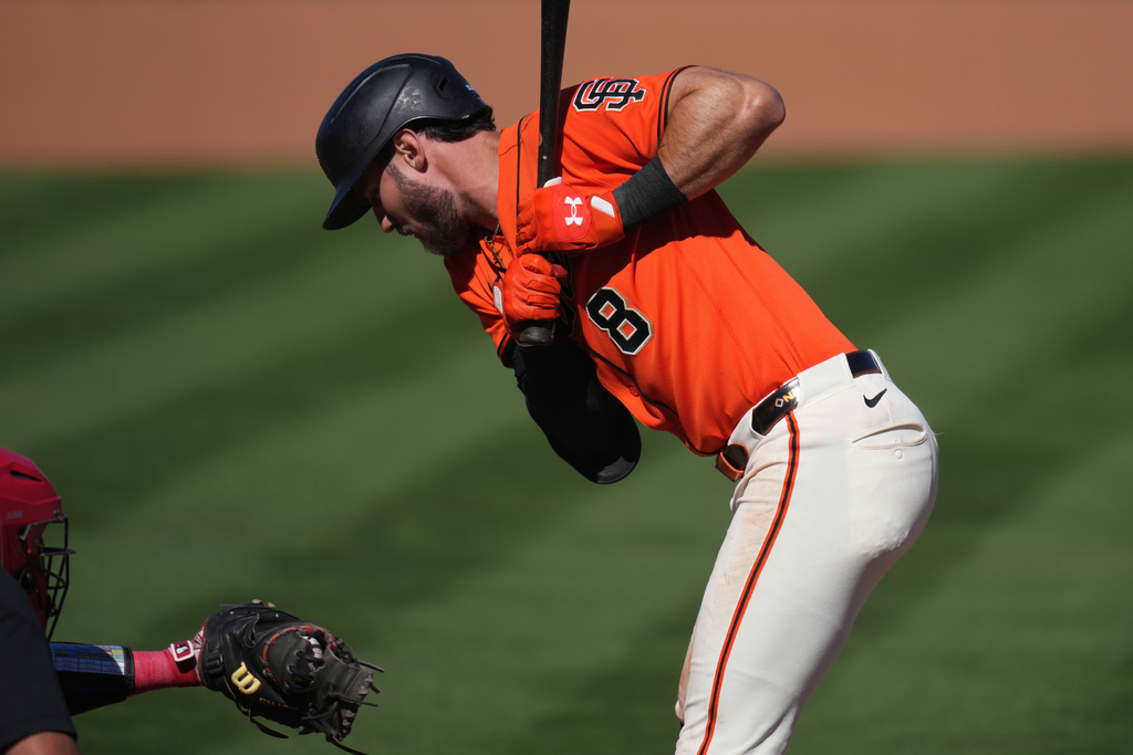 San Francisco Giants' Bryce Eldridge (8) backs away from an inside pitch caught by Cincinnati Reds catcher Tyler Stephenson during the fifth inning of a spring training baseball game Friday, March 6, 2026, in Scottsdale, Ariz. (AP Photo/Ross D. Franklin)