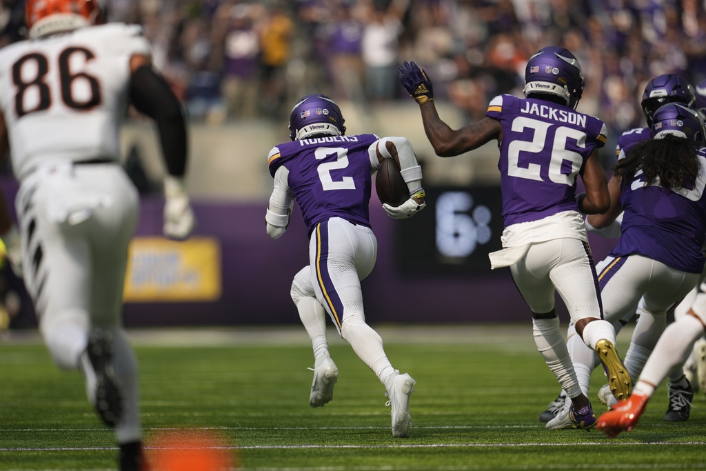 Minnesota Vikings cornerback Isaiah Rodgers (2) runs back an interception for a touchdown during the first half of an NFL football game against the Cincinnati Bengals, Sunday, Sept. 21, 2025, in Minneapolis. (AP Photo/Mike Stewart)