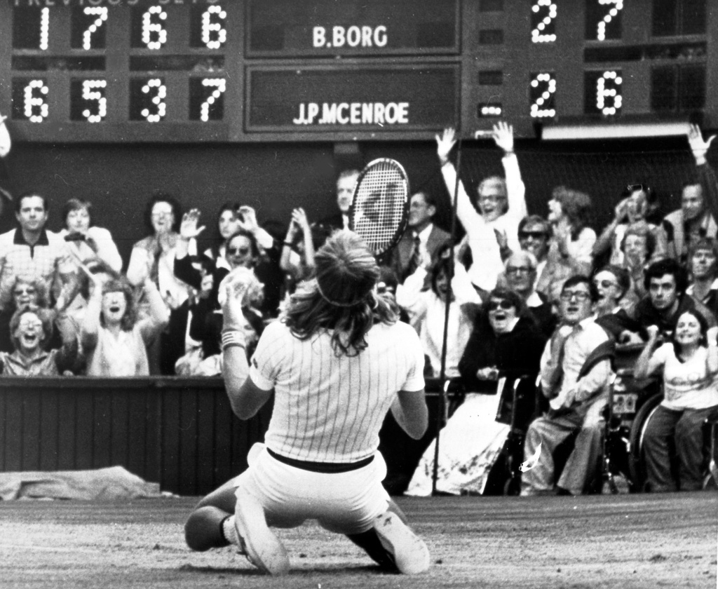 FILE - Sweden's Björn Borg falls to his knees in front of the scoreboard on the Centre Court at Wimbledon in London, July 5, 1980, after defeating John McEnroe, of the United States, to take the men's singles final for the fifth year in succession. (AP Photo/Robert Dear, File)