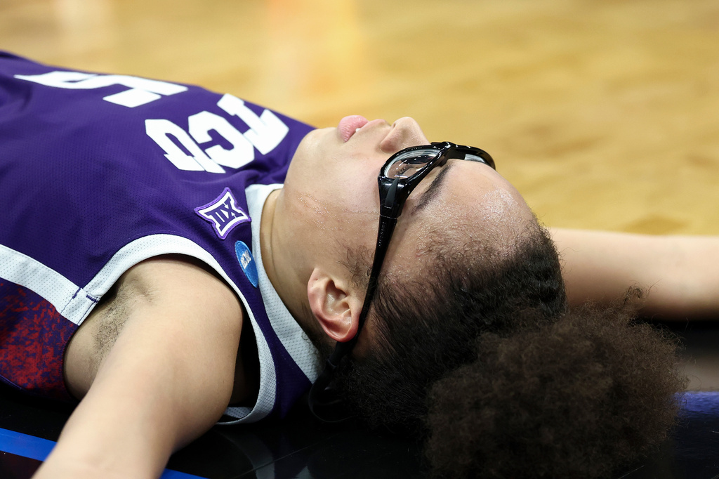 TCU guard Olivia Miles lies on the court after being fouled during the first half against South Carolina in the Elite Eight of the NCAA college basketball tournament Monday, March 30, 2026, in Sacramento, Calif. (AP Photo/Sara Nevis)
