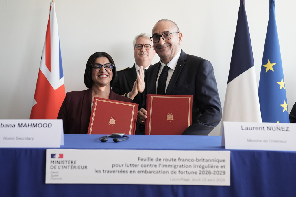 Britain's Home Secretary Shabana Mahmood, left, signs an agreement with France's Interior Minister Laurent Nunez during her visit in Dunkirk, France, Thursday April 23, 2026. (Stefan Rousseau/Pool Photo via AP)