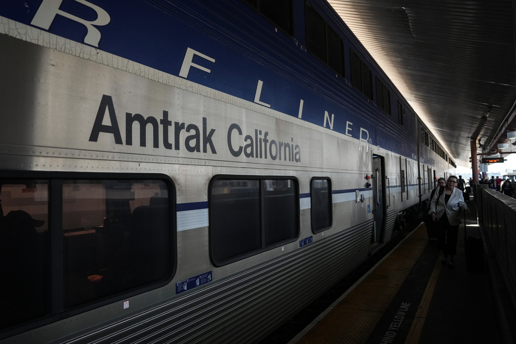 Passengers deboard an Amtrak train at Union Station in Los Angeles, Thursday, April 30, 2026. (AP Photo/Jae C. Hong)
