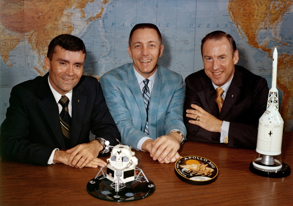 FILE - In this April 10, 1970, photo made available by NASA, Apollo 13 astronauts, from left, Fred Haise, Jack Swigert and Jim Lovell, gather for a photo on the day before launch. (NASA via AP, File)