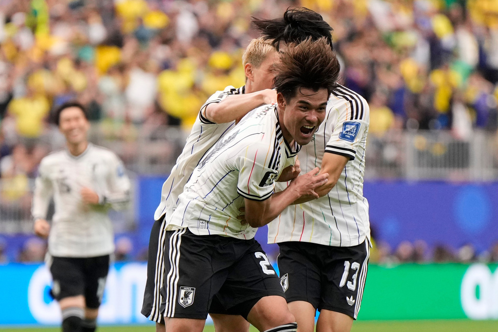 Japan's Kaishu Sano (24) celebrates after scoring the opening goal of his team during the World Cup round of 32 soccer match between Brazil and Japan in Houston, Monday, June 29, 2026. (AP Photo/Ashley Landis)