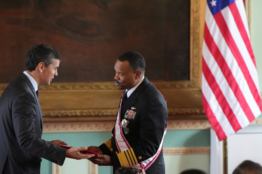 FILE - Paraguay's President Santiago Peña awards the Order of Merit "Gral Div Bernardino Caballero" in the grade of "Gran Cross", to Navy Adm. Alvin Holsey, commander of US Southern Command, at Government Palace in Asuncion, Paraguay, Aug. 23, 2025. (AP Photo/Jorge Saenz, File) FILE - Paraguay's President Santiago Peña awards the Order of Merit "Gral Div Bernardino Caballero" in the grade of "Gran Cross", to Navy Adm. Alvin Holsey, commander of US Southern Command, at Government Palace in Asuncion, Paraguay, Aug. 23, 2025. (AP Photo/Jorge Saenz, File)
