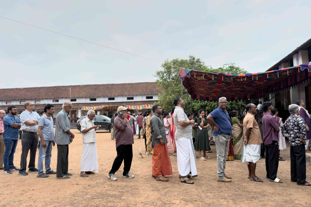 People queue up to vote outside a polling booth during the Kerala state election in Kochi, India, Thursday, April 9, 2026. (AP Photo/ R S Iyer)