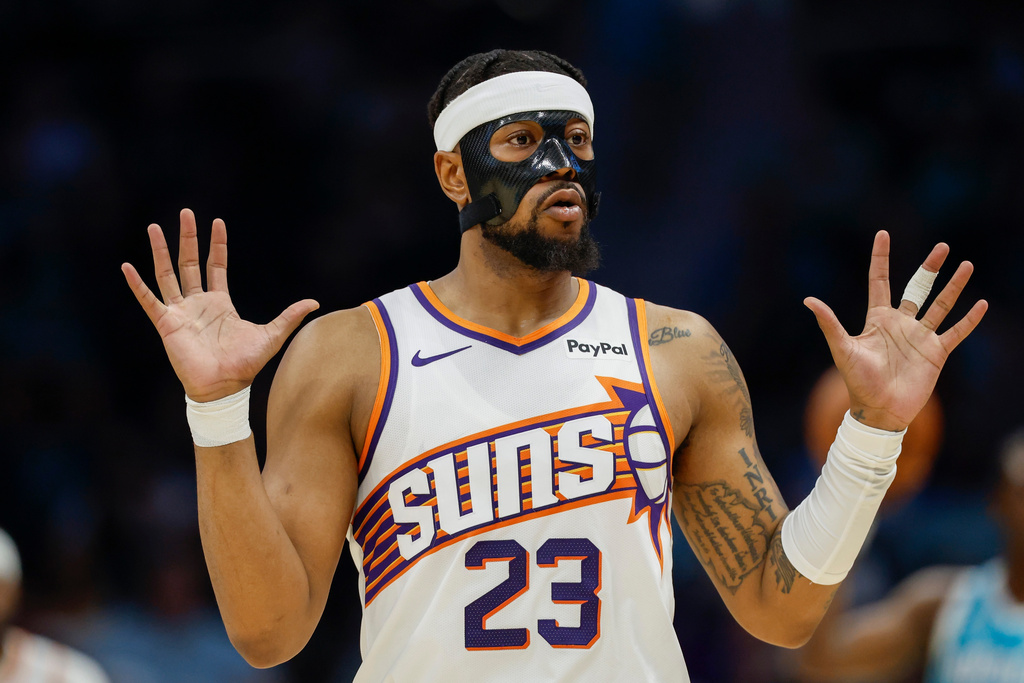 Phoenix Suns guard Jordan Goodwin reacts after being charged with a foul during the first half of an NBA basketball game against the Charlotte Hornets in Charlotte, N.C., Thursday, April 2, 2026. (AP Photo/Nell Redmond)