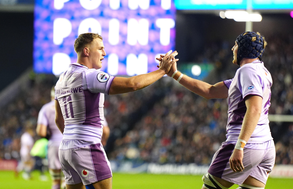 Scotland's Duhan van der Merwe, left, celebrates scoring his sides second try of the game during the rugby union Series match between Scotland and the USA at in Edinburgh, Saturday, Nov. 4, 2025. (Jane Barlow/PA via AP)