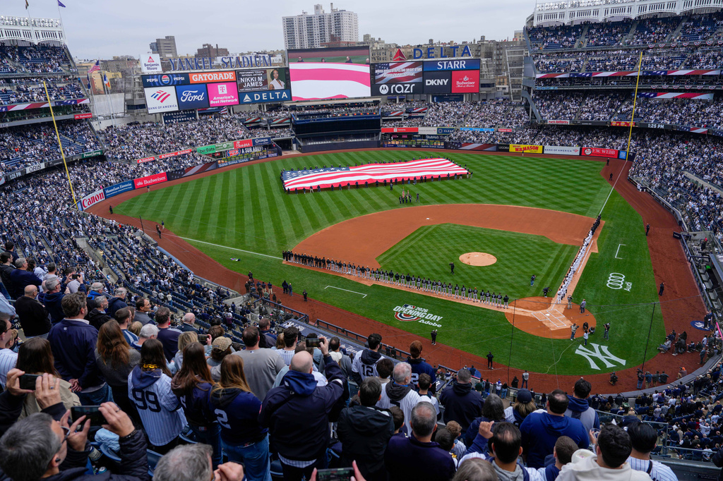 An American flag is displayed in the outfield before the New York Yankees' home-opener baseball game against the Miami Marlins, Friday, April 3, 2026, in New York. (AP Photo/Yuki Iwamura)