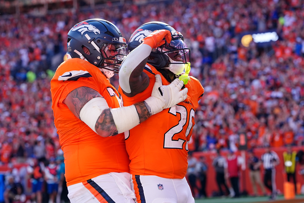 Denver Broncos running back Jonah Coleman (20) is congratulated by Ben Powers after Coleman scored a touchdown against the Jacksonville Jaguars in the second half of an NFL football game in Denver, Sunday, Sept. 20, 2026. (AP Photo/David Zalubowski)