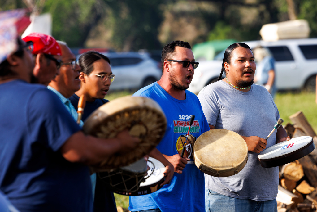 Drummers honor runners during festivities to commemorate the 150th anniversary of the Battle of the Little Bighorn, Thursday, June 25, 2026, in Crow Agency, Mont. (AP Photo/Tailyr Irvine)