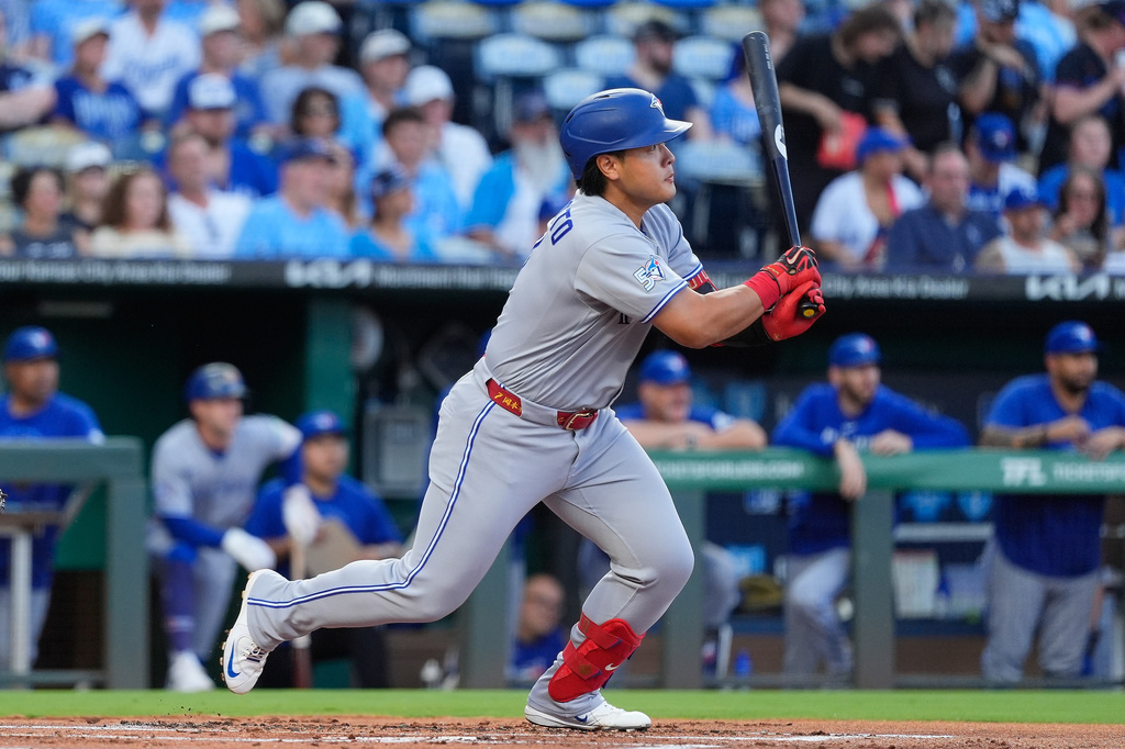 Toronto Blue Jays' Kazuma Okamoto watches his RBI single during the first inning of a baseball game against the Kansas City Royals, Friday, Sept. 4, 2026, in Kansas City, Mo. (AP Photo/Charlie Riedel)
