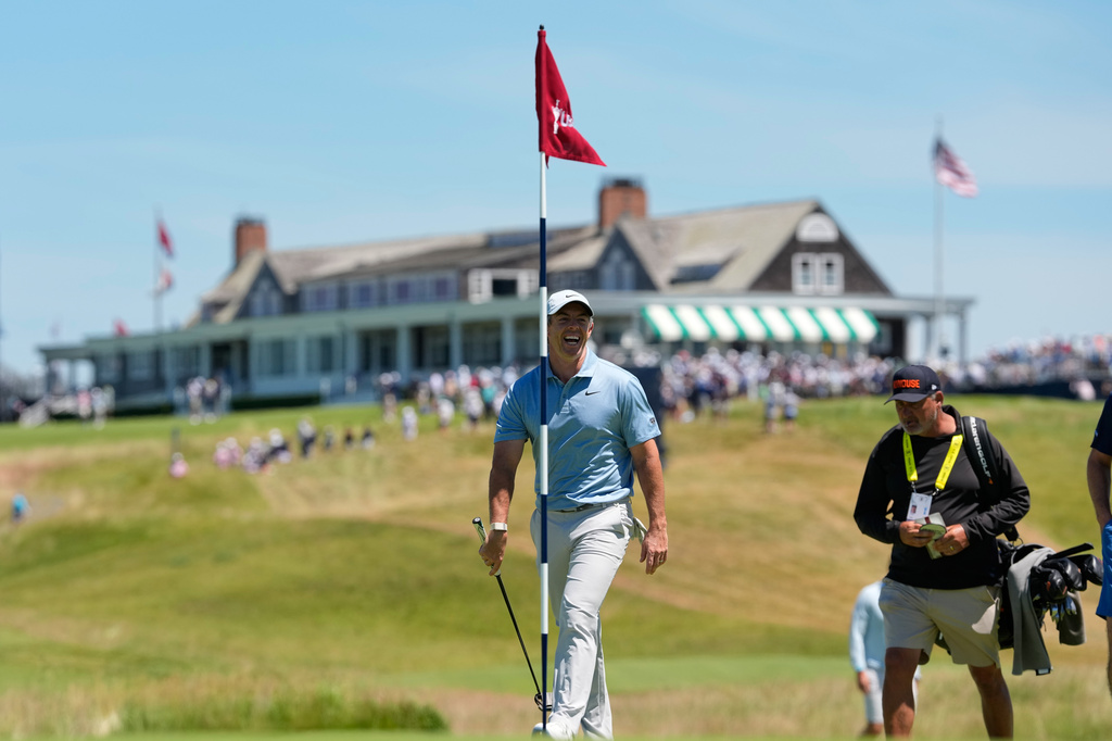 Rory McIlroy, of Northern Ireland, walks to green on the first hole during a practice round for the U.S. Open golf tournament at Shinnecock Hills Golf Club in Southampton, N.Y., Tuesday, June 16, 2026.(AP Photo/David J. Phillip)
