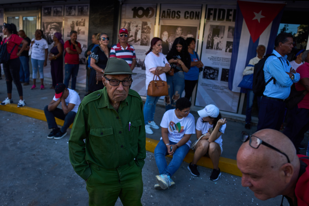 People attend a celebration marking the 65th anniversary of the proclamation declaring the Cuban Revolution socialist, in Havana, Cuba, Thursday, April 16, 2026. (AP Photo/Ramon Espinosa)
