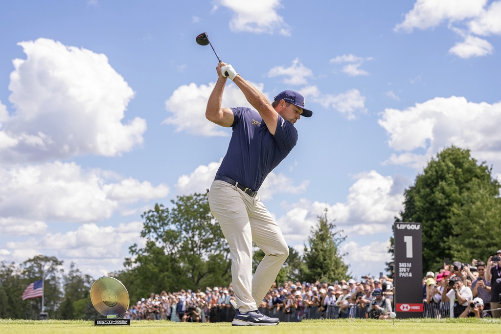 Captain Bryson DeChambeau, of Crushers GC, hits from the first tee during the final round of LIV Golf Team Championship Michigan at The Cardinal at Saint John's, Sunday, Aug. 24, 2025, in Plymouth, Mich. (Pedro Salado/LIV Golf via AP)