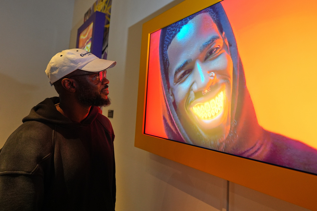 Willonius Hatcher, also known as King Willonius, with his presentation entitled "I'm McLovin It (Popeye’s Diss Song)” at the a16z AI Creative Gallery, Thursday, Sept. 18, 2025, in New York. (AP Photo/Frank Franklin II)