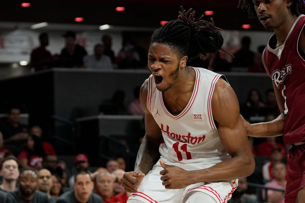 Houston forward Joseph Tugler (11) reacts during the second half of an NCAA college basketball game against Rider, Thursday, Nov. 20, 2025, in Houston. (AP Photo/Kevin M. Cox)