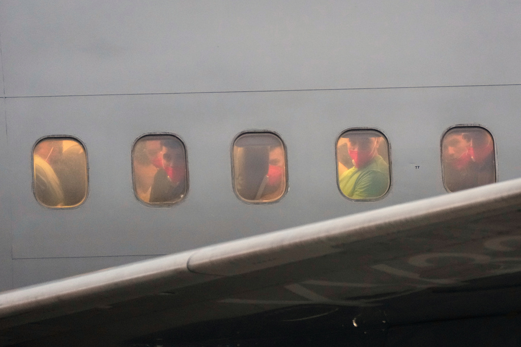 FILE - Migrants deported months ago by the United States to El Salvador under the Trump administration's immigration crackdown arrive at Simon Bolívar International Airport, in Maiquetia, Venezuela, July 18, 2025. (AP Photo/Ariana Cubillos, File)