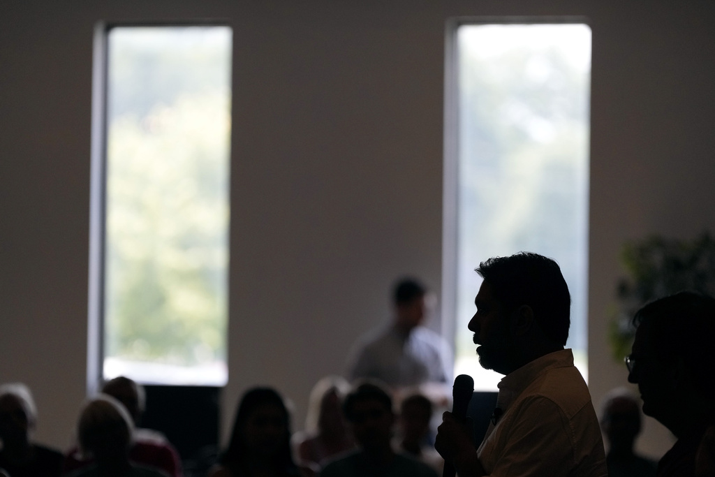 Sen. Ruben Gallego, D-Ariz., speaks during a town hall meeting, Saturday, Aug. 9, 2025, in Davenport, Iowa. (AP Photo/Charlie Neibergall)