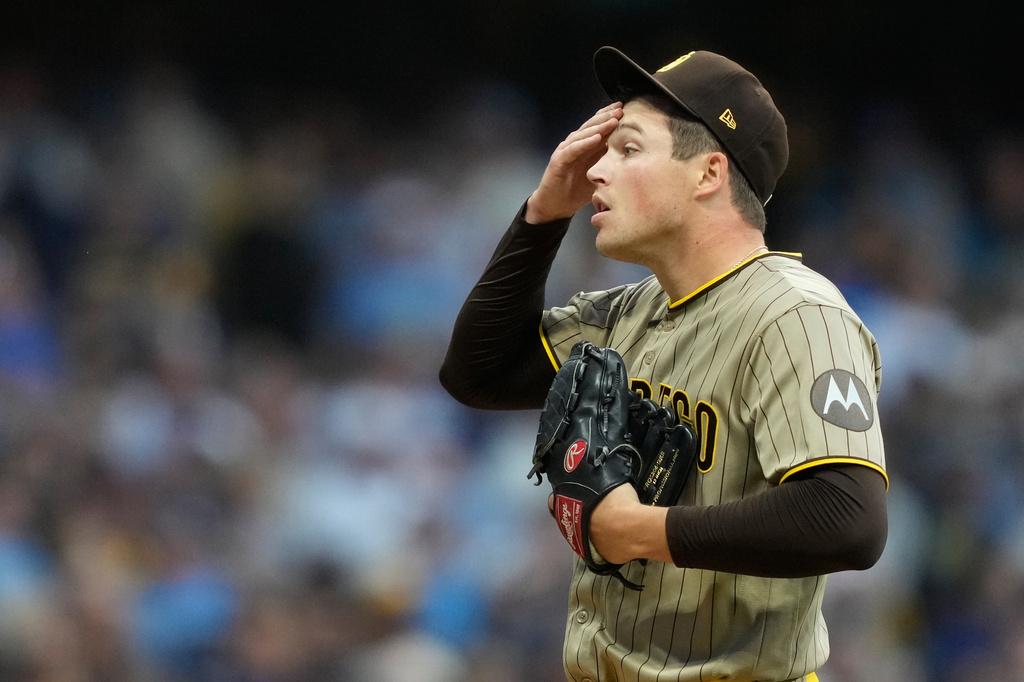 San Diego Padres' Mason Miller reacts during the ninth inning of Game 2 of a National League Divisional baseball playoff series against the Milwaukee Brewers Sunday, Oct. 4, 2026, in Milwaukee. (AP Photo/Kayla Wolf)