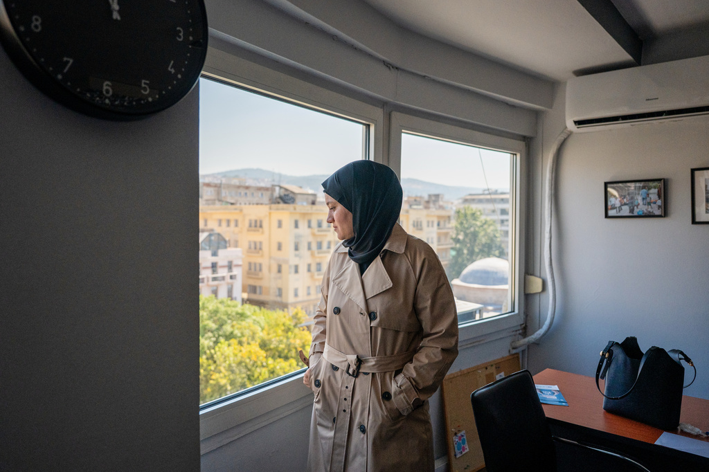Wesam Hamada, the mother of Hind Rajab, a Palestinian girl who was killed in Gaza City in January 2024 after the car she was in with relatives came under Israeli fire, looks out a window at an office building at an undisclosed location, Friday, Aug. 21, 2026. (AP Photo/Giannis Papanikos) ADDITION: Location removed at the subject's request.