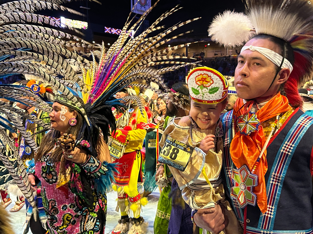 Hundreds of dancers enter the arena during the opening grand entry at the last Gathering of Nations powwow in Albuquerque, New Mexico, on Friday, April 24, 2026. (AP Photo/Susan Montoya Bryan)