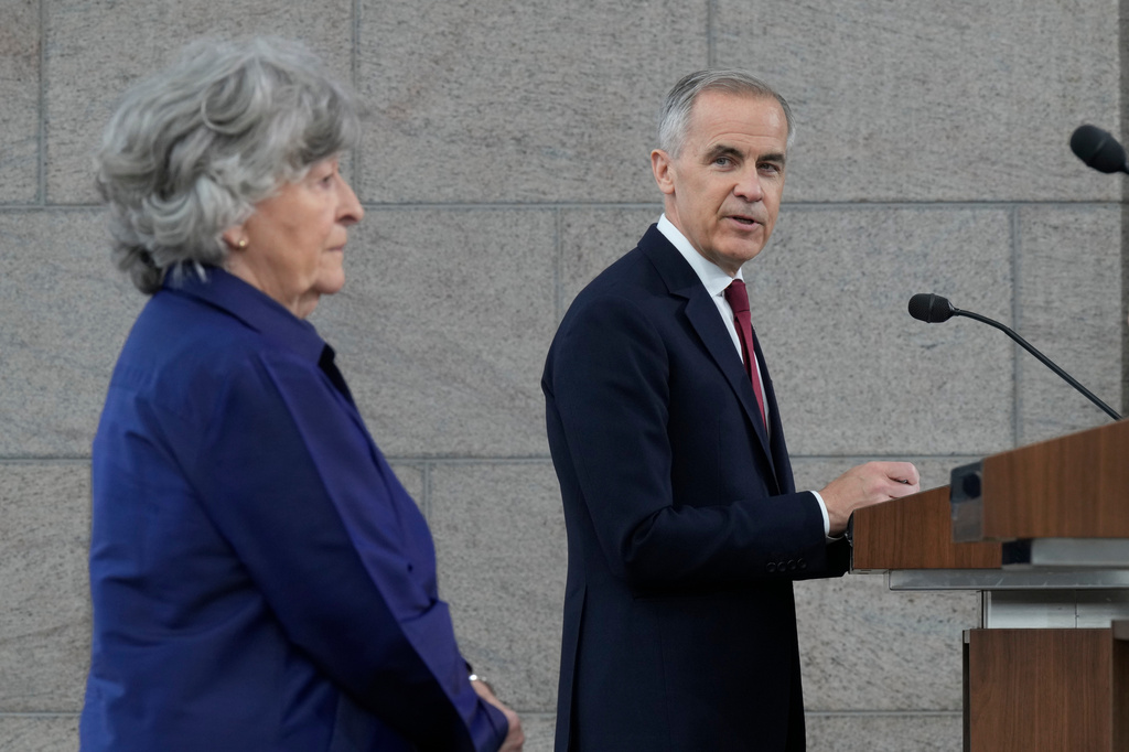 Canada Prime Minister Mark Carney and Louise Arbour take part in an announcement in Ottawa on Tuesday, May 5, 2026. (Adrian Wyld/The Canadian Press via AP)