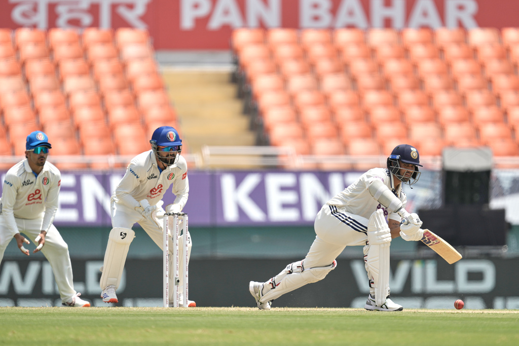 India's Washington Sundar, right, bats on day two of the cricket test match between Afghanistan and India in New Chandigarh, India, Sunday, June 7, 2026. (AP Photo/Ashwini Bhatia)