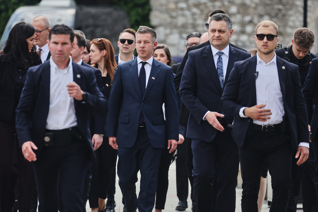 Hungarian Prime Minister Peter Magyar, center, arrives at the Wawel Cathedral during his visit in Krakow, Poland Tuesday, May 19, 2026. (AP Photo/Beata Zawrzel)