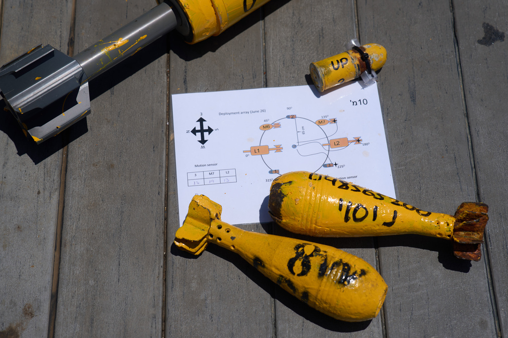 Mock munitions, to be placed by divers on the floor of the Mediterranean Sea, are displayed off the coast of Rishon LeZion, Israel, Sunday, June 21, 2026. (AP Photo/Ariel Schalit)