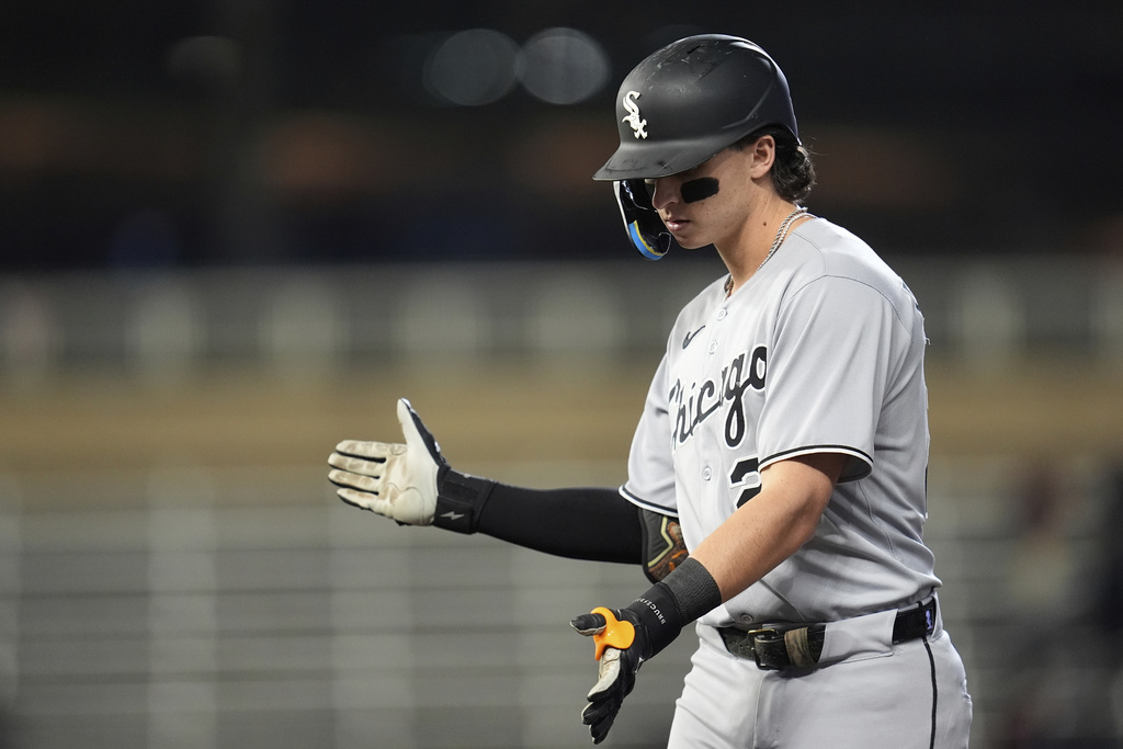 Chicago White Sox's Brooks Baldwin claps after hitting a RBI-single during the ninth inning of a baseball game against the Minnesota Twins Wednesday, Sept. 3, 2025, in Minneapolis. (AP Photo/Abbie Parr)