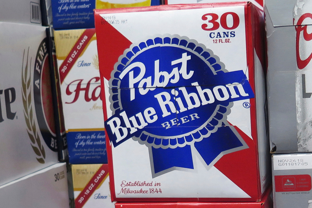 FILE - Cases of Pabst Blue Ribbon beer are stacked in a liquor store, Nov. 8, 2018, in Milwaukee. (AP Photo/Ivan Moreno, File)