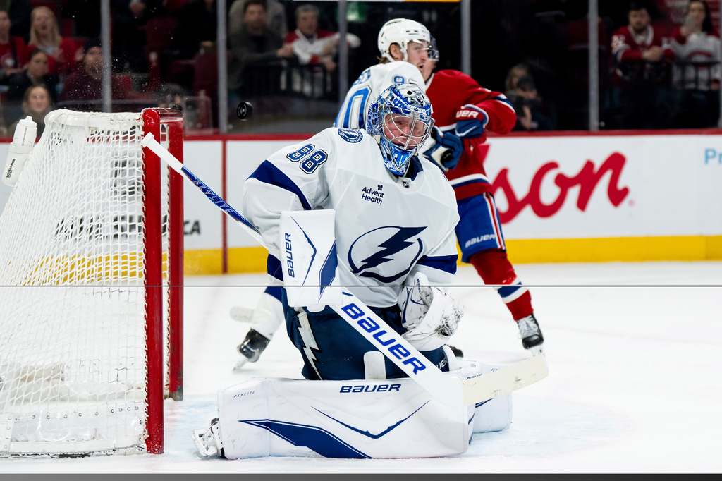 Tampa Bay Lightning goaltender Andrei Vasilevskiy (88) makes a save during first-period NHL hockey game action against the Montreal Canadiens in Montreal, Thursday, April 9, 2026. (Christopher Katsarov/The Canadian Press via AP)