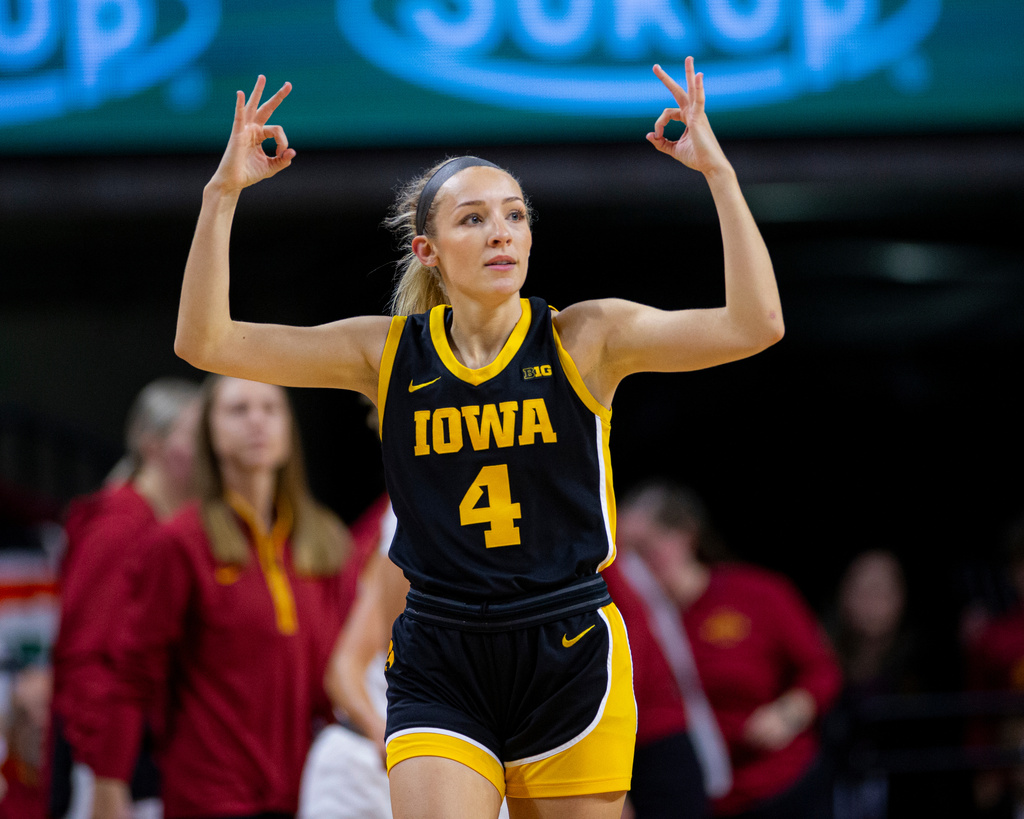 Iowa guard Kylie Feuerbach (4) celebrates after making a three-pointer during an NCAA college basketball game against Iowa State in Ames, Iowa, Wednesday, Dec. 10, 2025. (Nick Rohlman/The Gazette via AP)