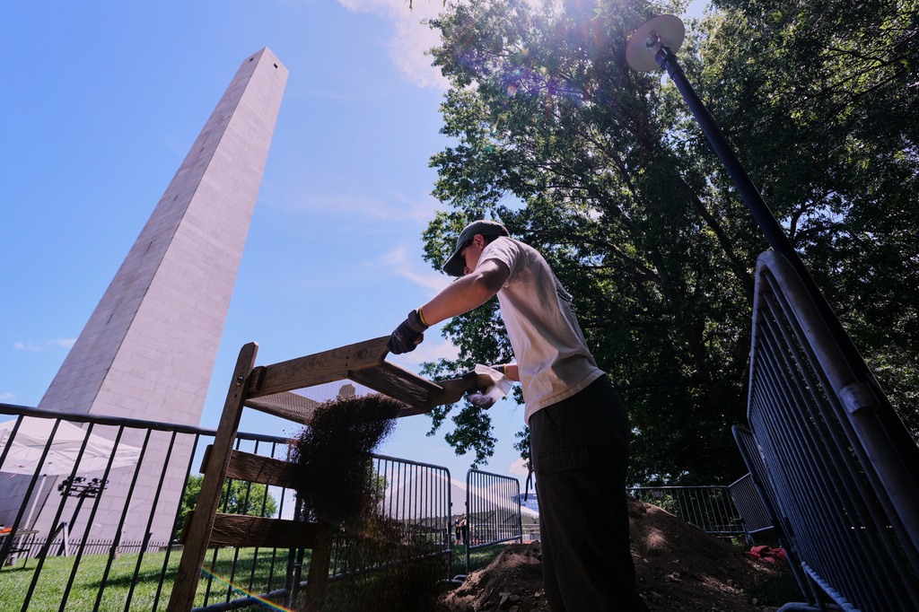 Calla Ruff, an intern from Carleton College, sifts dirt removed from an archaeological dig at the site of the Battle of Bunker Hill, Monday, June 15, 2026, in Boston. (AP Photo/Charles Krupa)