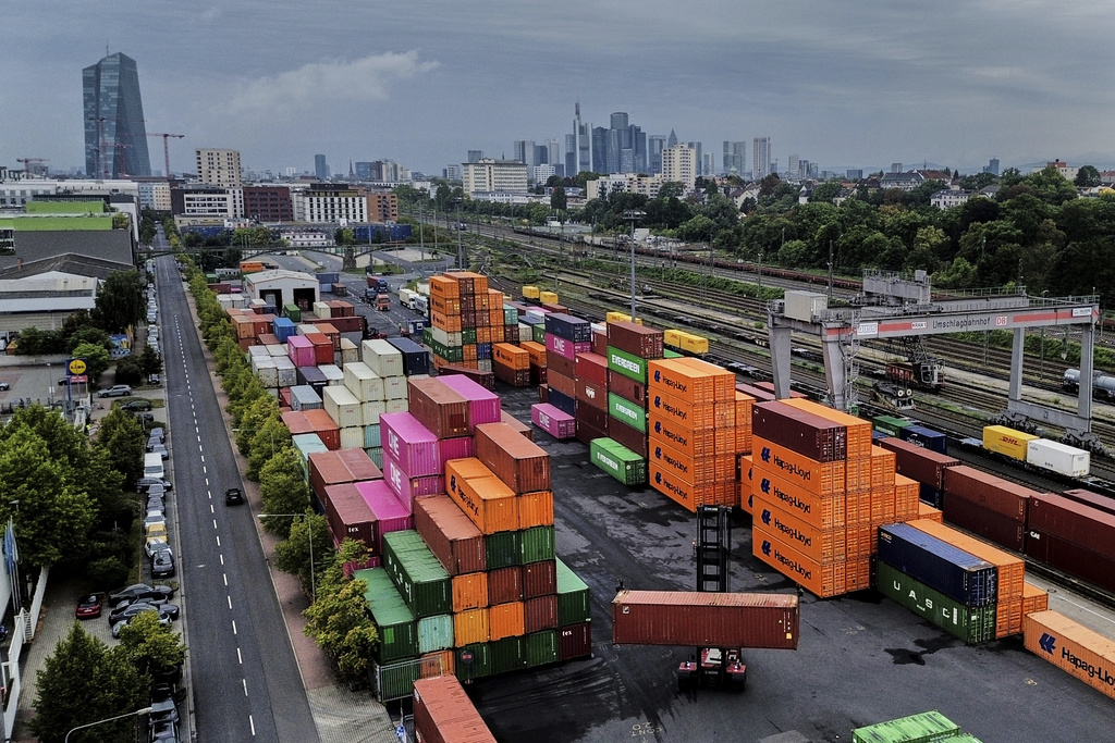 Containers are piled upon a cargo terminal in Frankfurt, Germany, Tuesday, Sept. 9, 2025. (AP Photo/Michael Probst)