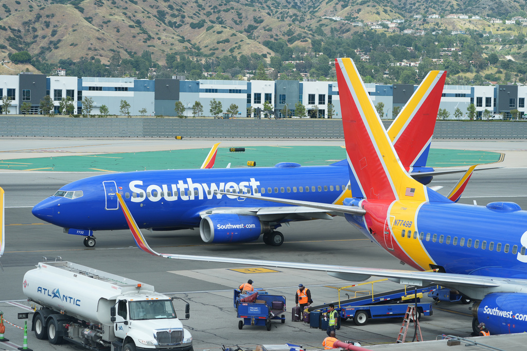 Southwest Airlines grounds crew refuel an aircraft at Hollywood Burbank Airport in Burbank, Calif., Friday, April 10, 2026. (AP Photo/Damian Dovarganes)
