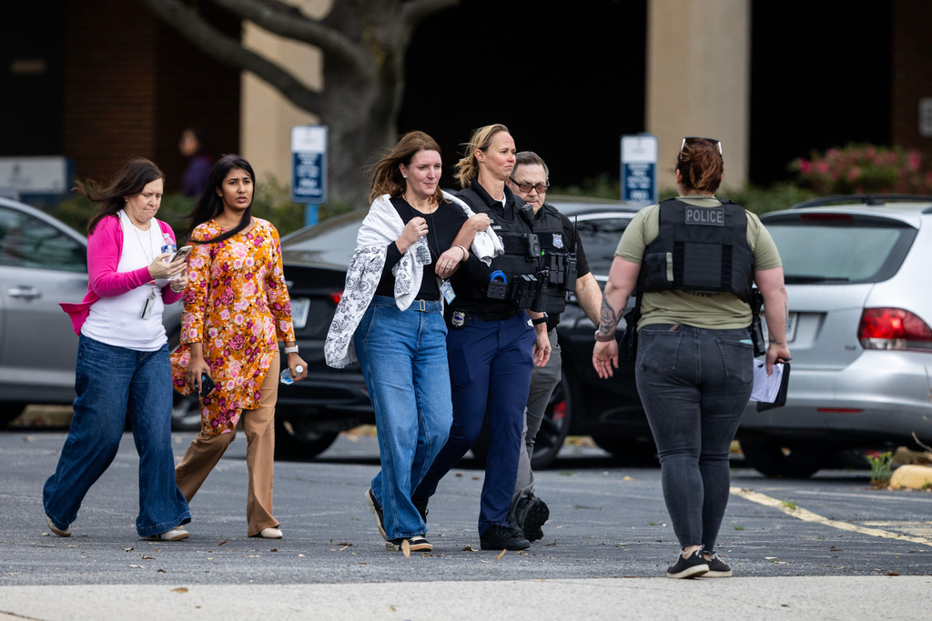 Bystanders are evacuated from Old Dominion University's campus after reports of an active shooter on Thursday, March 12, 2026 in Norfolk, Va. (Kendall Warner/The Virginian-Pilot via AP)