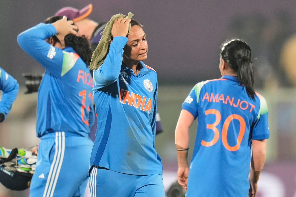 India's captain Harmanpreet Kaur, center, leaves the field after their loss in the ICC Women's Cricket World Cup match against Australia at ACA-VDCA Cricket Stadium in Visakhapatnam, India, Sunday, Oct. 12, 2025. (AP Photo/Aijaz Rahi)