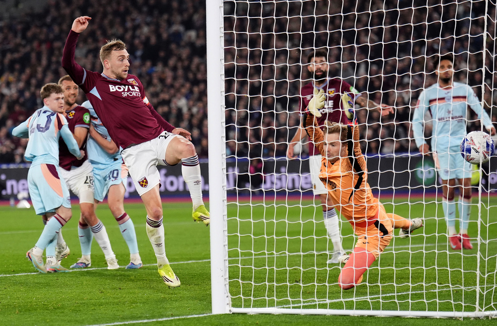 West Ham United's Jarrod Bowen scores during the English FA Cup fifth round soccer match between West Ham United and Brentford in London, Monday March 9, 2026. (John Walton/PA via AP)