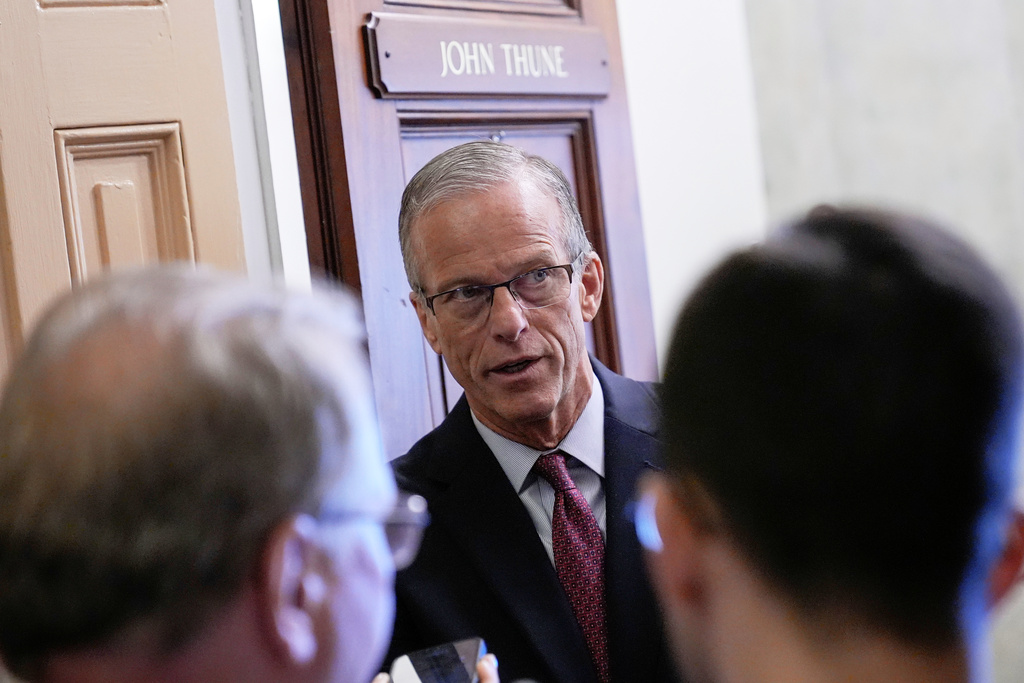 Sen. Majority Leader John Thune, R-S.D., speaks with reporters near his office on Capitol Hill, Thursday, Sept. 18, 2025, in Washington. (AP Photo/Mariam Zuhaib)