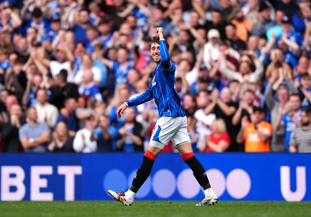 Rangers' Daniel Neil celebrates scoring their side's third goal during the Scottish League Cup soccer match between Rangers and Celtic, in Glasgow, Sunday Sept. 13, 2026. (Andrew Milligan/PA via AP)