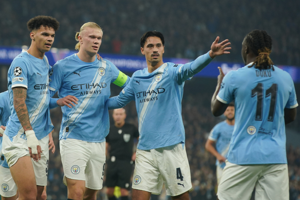 Manchester City's Erling Haaland, 2nd left, celebrates with team mates after scoring his side's second goal during the Champions League opening phase soccer match between Manchester City and Borussia Dortmund in Manchester, England, Wednesday, Nov. 5, 2025. (AP Photo/Ian Hodgson)