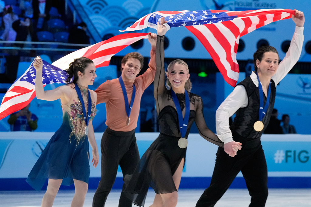 From left silver medalists Caroline Green and Michael Parsons of the United States and gold medalists Emilea Zingas and Vadym Kolesnik of the United States celebrate after the Ice Dance Free Dance of the ISU Four Continents Figure Skating Championships in Beijing, China, Friday, Jan. 23, 2026. (AP Photo/Vincent Thian)