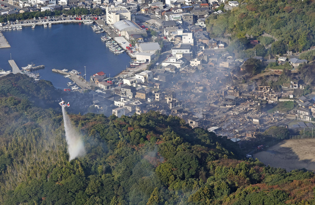 The aftermath of a fire is seen in Oita, southern Japan, Wednesday, Nov. 19, 2025. (Takumi Sato/Kyodo News via AP)