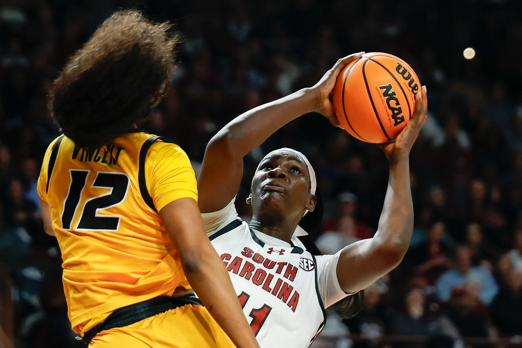 South Carolina center Madina Okot, right, looks to shoot against Missouri guard Ma'riya Vincent during the first half of an NCAA college basketball game in Columbia, S.C., Thursday, Feb. 26, 2026. (AP Photo/Nell Redmond)