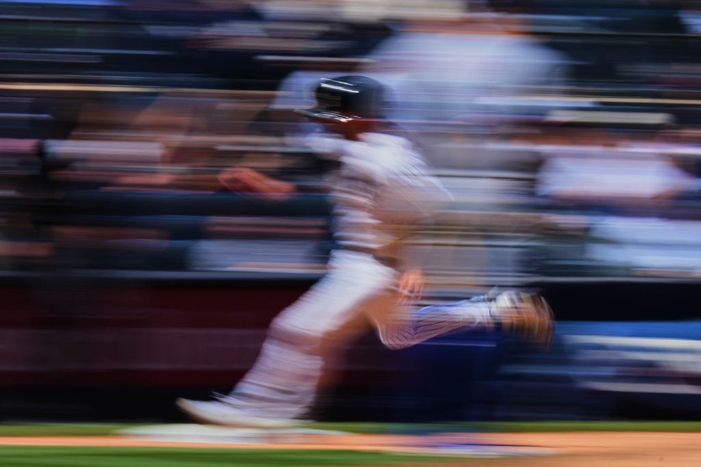 New York Yankees' Ryan McMahon runs to home plate to score on a double by Trent Grisham during the sixth inning of a baseball game Thursday, May 7, 2026, in New York. (AP Photo/Frank Franklin II)
