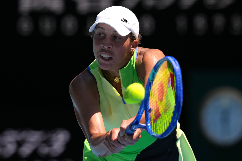 Madison Keys of the U.S. plays a backhand return to her compatriot Jessica Pegula during their fourth round match at the Australian Open tennis championship in Melbourne, Australia, Monday, Jan. 26, 2026. (AP Photo/Mark Baker)