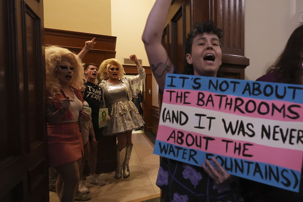 Protesters take over a women's restroom as they speak out against an anti-transgender bathroom bill at the Texas Capitol in Austin, Texas, Friday, Aug. 22, 2025. (AP Photo/Eric Gay)